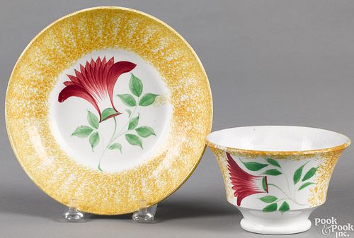 Yellow spatter cup and saucer, with thistle.