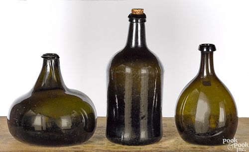 Three blown olive glass bottles, ca. 1800
