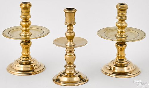 Three brass Heemskerk Dutch candlesticks