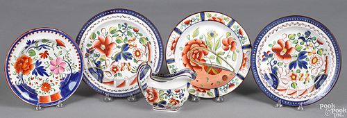 Four Gaudy Dutch plates and a cream pitcher