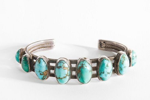 A Navajo Eight Stone Turquoise and Silver Bracelet, ca. 1910