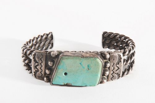 A Navajo Turquoise and Silver Cuff Bracelet, ca. 1930-1940