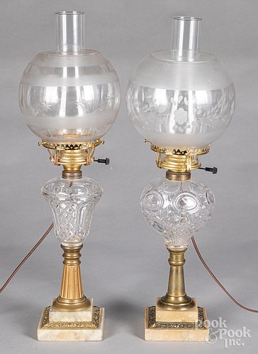 Two glass fluid lamps, with etched shades.
