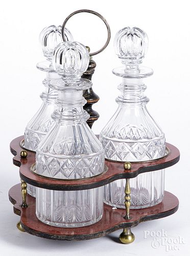 Red lacquer cruet stand, with cut glass bottles