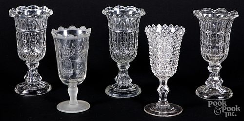 Five colorless glass vases