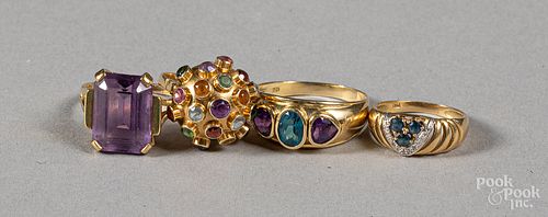 Four 18K gold and gemstone rings