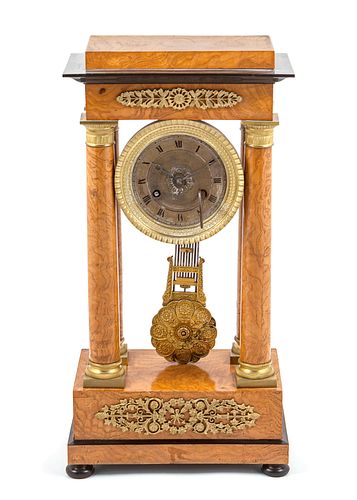A Charles X Gilt Metal Mounted Burlwood Portico Clock