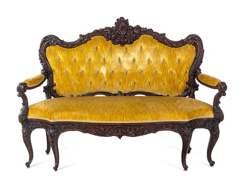 A Rococo Revival Carved Walnut Settee