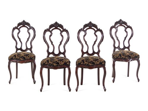 A Set of Four Rococo Revival Mahogany Side Chairs
