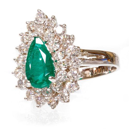 0.90 carat emerald weight and 1.20 carat total diamond weight ring