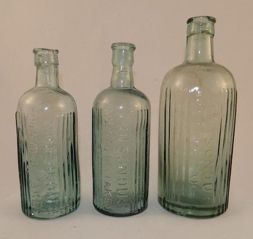 3 Poison aqua round bottles