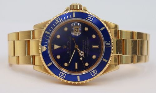 JEWELRY. Men's Rolex 18kt Gold Submariner Watch.