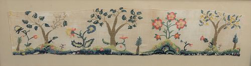 Framed Embroidered Crewelwork on linen, fragment, bedspread having embroidered trees and flowers, 18th century or later. 
fragment: 8 1/2" x 41 1/2".