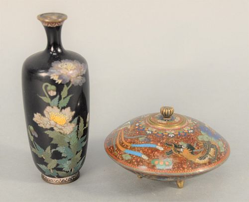 Two Japanese Cloisonne Pieces to include a vase having navy ground and sprays of purple and white flowers, and a lidded round box ha...