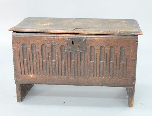 Diminutive Oak Lift Top Chest having carved front, English, 17th century, top with old lock cut out.
height 17 1/4 inches, top 11 1/...
