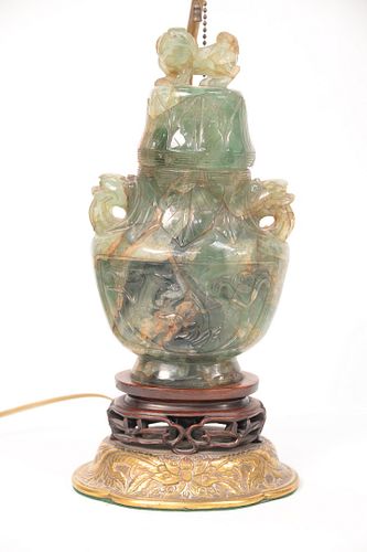 Chinese Green Quartz Urn, having Foo Dog finial and handles on carved wood base and bronze lamp base.
total height 25 3/4 inches, va...