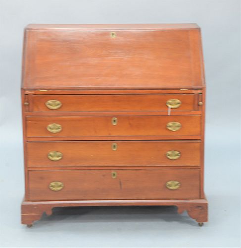 Chippendale Cherry Desk with slant lid, over four drawers on bracket base.
height 43 inches, width 39 1/2 inches.