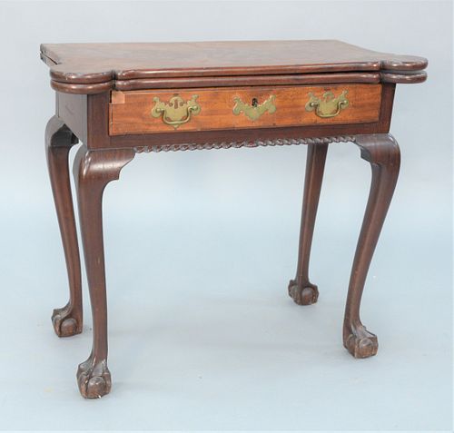 Diminutive Chippendale Mahogany Games Table having shaped top with rounded corners over one drawer over gadrooned molding all set on...