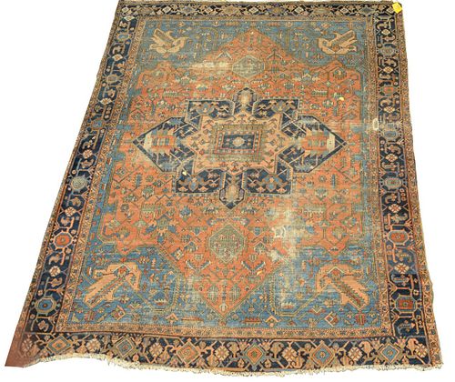 Heriz Oriental Carpet, probably late 19th or early 20th century, worn with holes and ends fraying.
9' 7" x 11' 5".