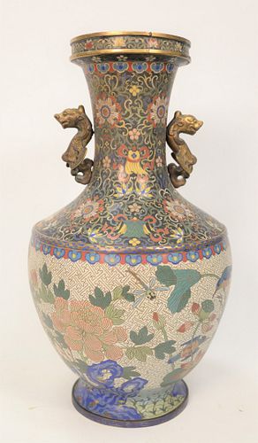 Large Cloisonne and Bronze Vase having blossoming lotus with scrolling flowers, birds and fish with brass foo dog handles.
height 22...