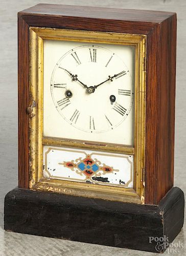 Atkins round top rosewood shelf clock, 15 3/4'' h., together with a Waterbury rosewood cottage clock