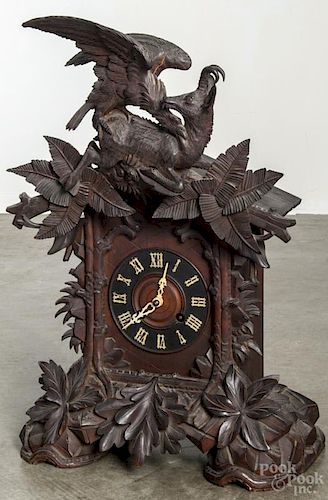 Black Forest carved cuckoo clock, late 19th c., with a brass movement, signed Faller, 25 1/2'' h.