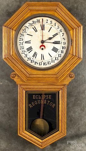 New Haven Eclipse regulator clock with an oak case, 33'' h.