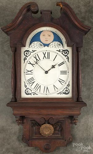 Oak free swinging wall clock, 34'' h.