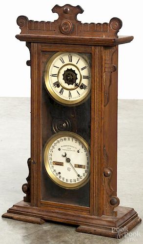 Waterbury oak double dial calendar clock, 23 3/4'' h.