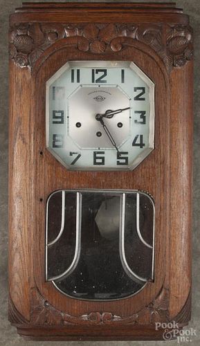 French Girod carved walnut wall clock with a Westminster chime, 27'' h.