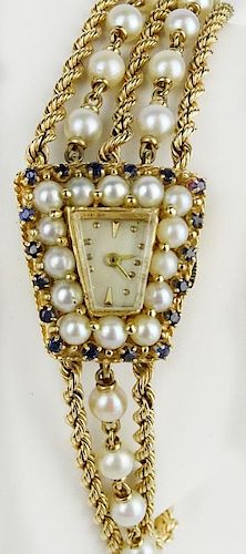 Lady's Edwardian 14 Karat Yellow Gold, diamond, sapphire and pearl bracelet watch.