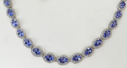 AIG Certified 19.06 Carat Oval Mixed Cut Natural Tanzanite, 4.84 Carat Round Brilliant Diamond and 14 K Necklace.