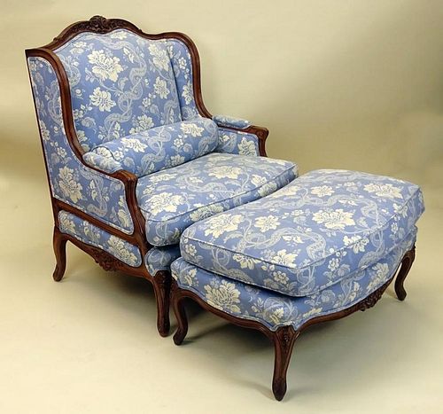 Nicely Carved Walnut upholstered bergere with ottoman and bolster.