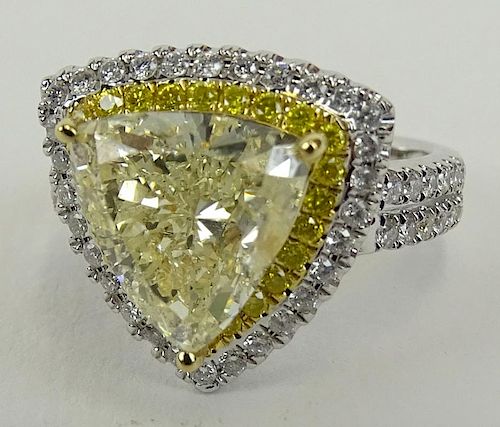 AIG Certified 4.03 Carat Very Light Yellow Diamond, 18 Karat white gold Ring.