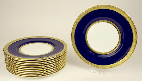 Set of Twelve (12) Coalport porcelain dessert plates with cobalt and gold rims.