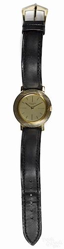 Patek Phillipe wrist watch with a leather band and an 18k gold buckle, 1 1/4" dia.