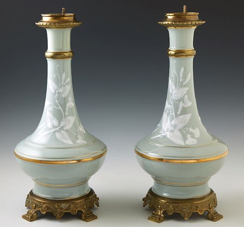Pair of French Gilt Brass Mounted Pate Sur Pate Celadon Porcelain Oil Lamps, 19th c., of Baluster form, with relief floral and leaf...