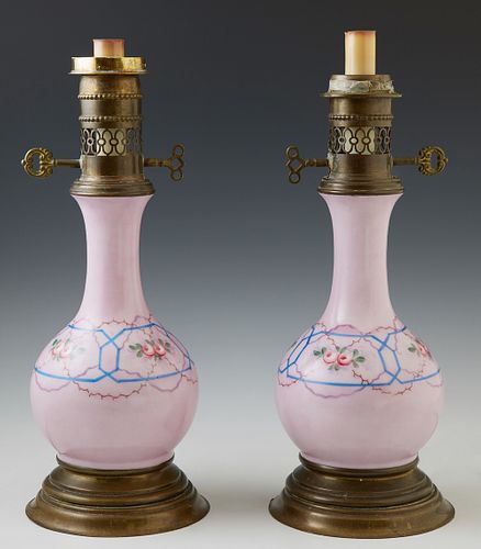 Pair of Old Paris Style Lavender Porcelain Bottle Form Oil Lamps, 19th c., with floral and polychromed decoration, on circular brass...