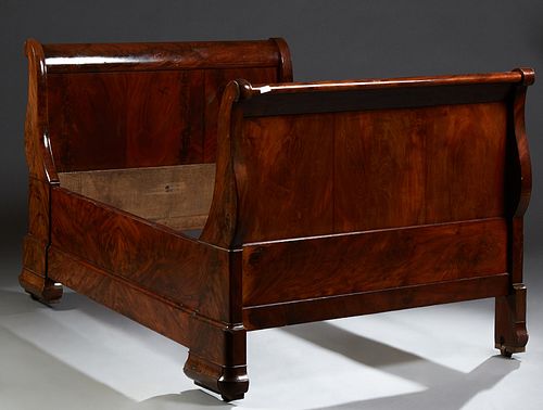 French Louis Philippe Carved Mahogany Lit du Coin, 19th c., the curved sleigh ends to a wide front rail, and a narrow rear rail, on...