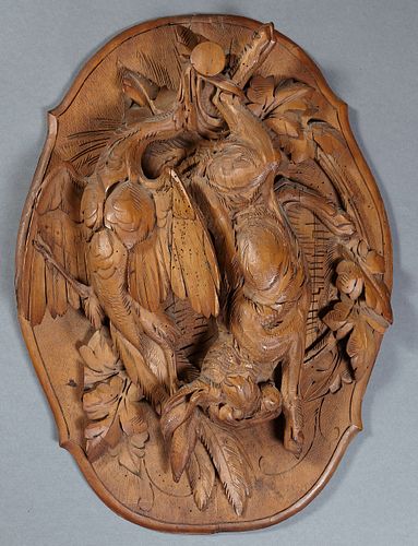 German Carved Walnut High Relief Natur Morte, 19th c., of a pheasant and a rabbit, on a shaped oval back plate, H.- 21 in., W.- 15 1...