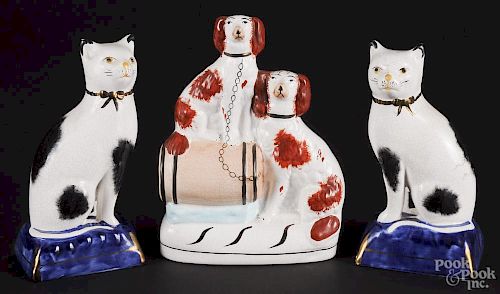 Staffordshire spaniel group, 8'' h., together with a pair of cats, 7 1/2'' h.