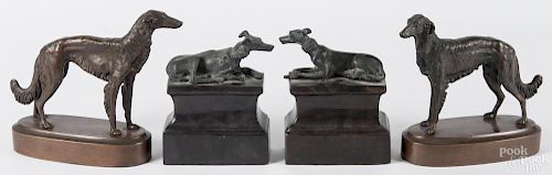 Two pairs of bronzed dog sculptures, 7'' h. and 8'' h.