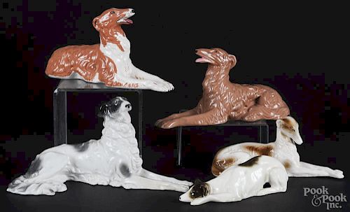 Five ceramic figures of reclining dogs, 20th c., longest - 12''.