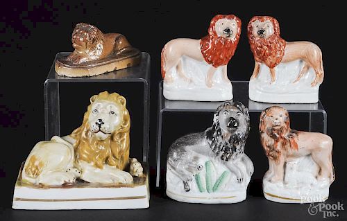 Five Staffordshire lions, 19th c., together with an earthenware lion, tallest - 3 3/4''.