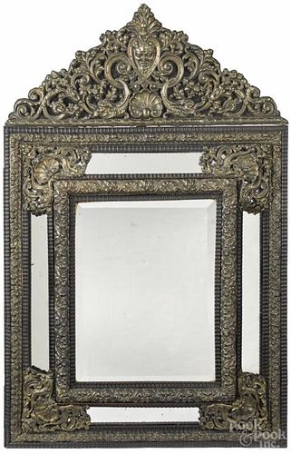 Continental ebonized and embossed brass mirror, mid 19th c., 45 1/2'' x 28 1/2''.