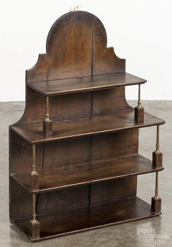 Softwood hanging shelf, late 19th c., with brass columns, 34'' h., 24'' w. Provenance: DeHoogh Gallery