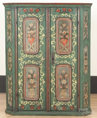 Scandinavian painted pine cupboard, early 19th c., retaining a later floral decorated surface, 58'' h.