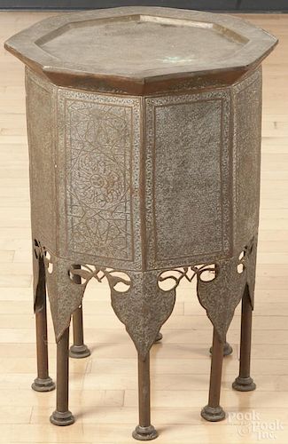 Moroccan embossed brass stand, 23 1/2'' h., 16 1/2'' w. Provenance: DeHoogh Gallery, Philadelphia.