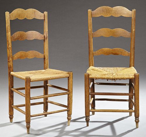 Pair of French Provincial Carved Cherry Rush Seat Side Chairs, 19th c., the three serpentine horizontal splats over a woven rush sea...