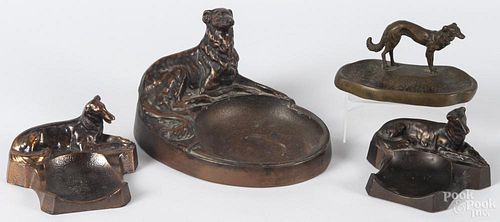 Four figural dog ash trays, to include a near pair copper borzoi, a bronze borzoi